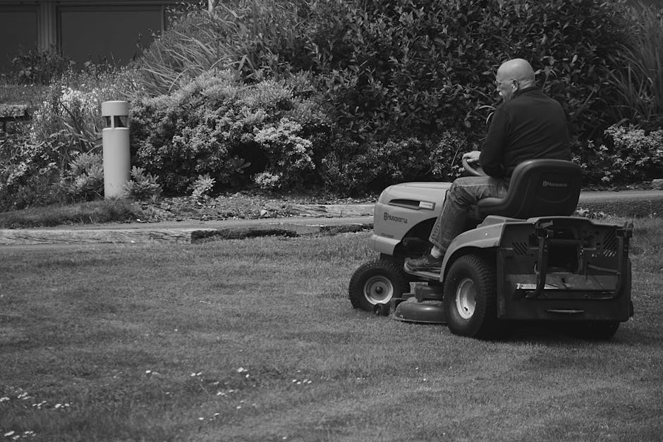 Riding lawn mower working on a large property